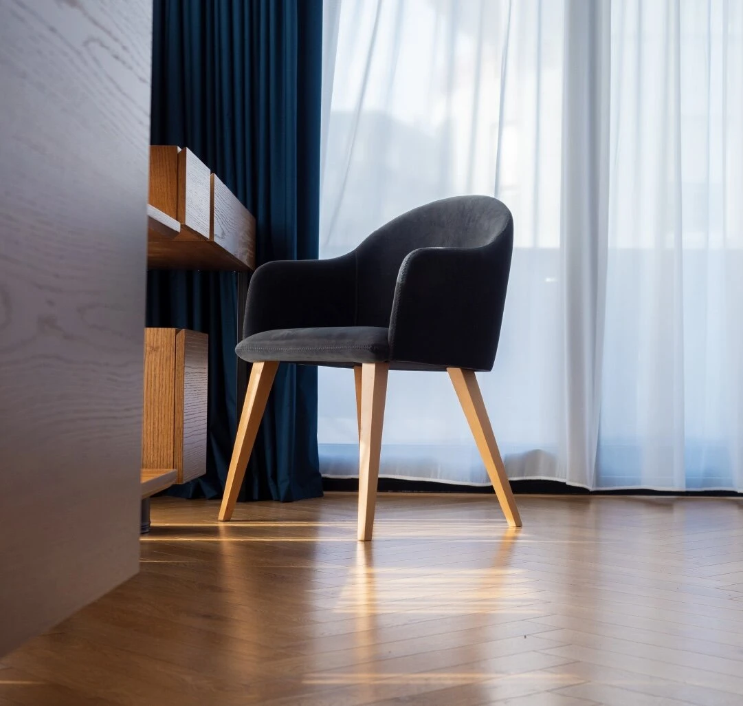 Close-up of Bob dining chair with armrest