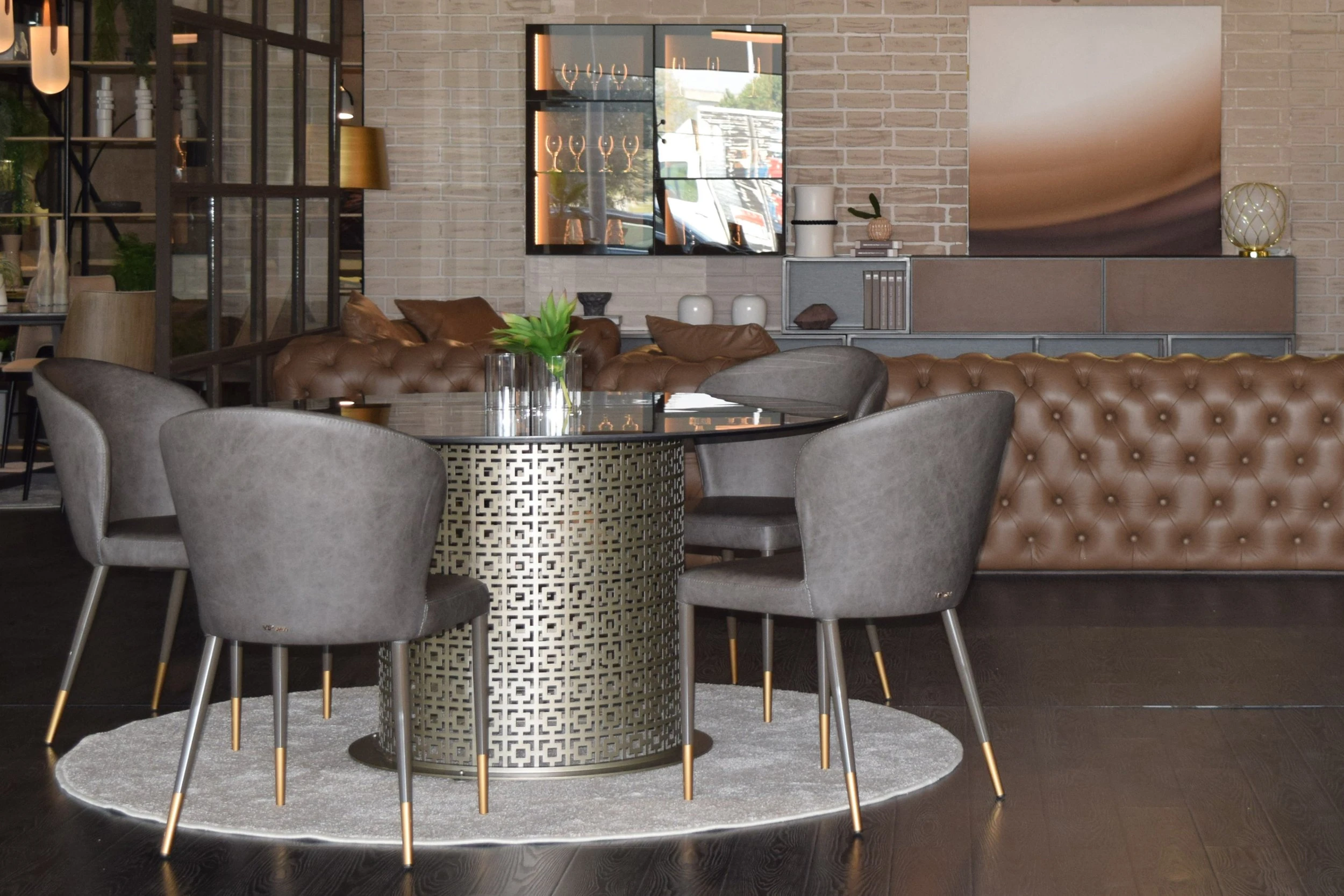 Charles round glass dining table is in a modern dining room