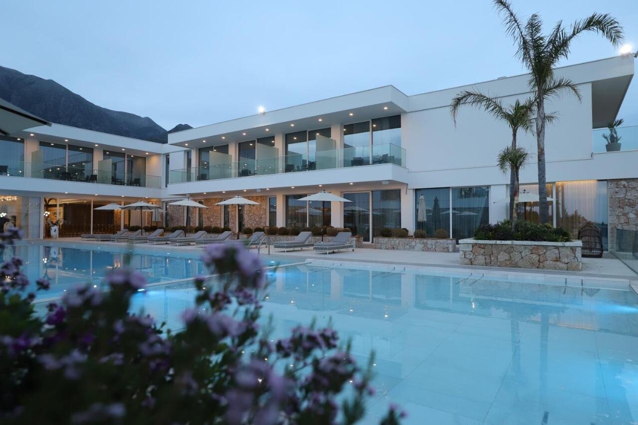 Empire Hotel Drymades - swimming pool and terrace in front of the hotel building, South Albania