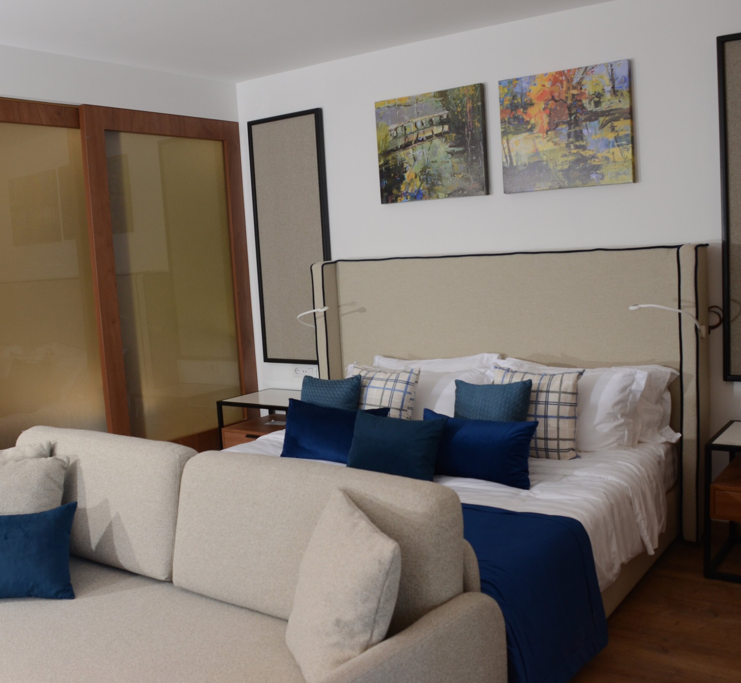 Gran Melia and San Pietro Residences - bedroom with a cream sofa, navy cushions and framed artwork, Durres
