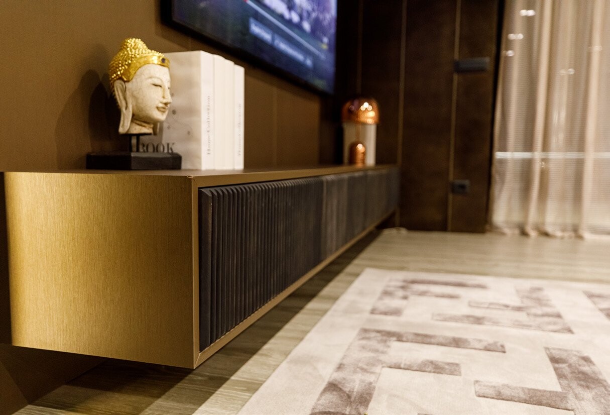 Private Villa South Albania - sideboard with a bronze sculpture below a wall-mounted television, Vlore