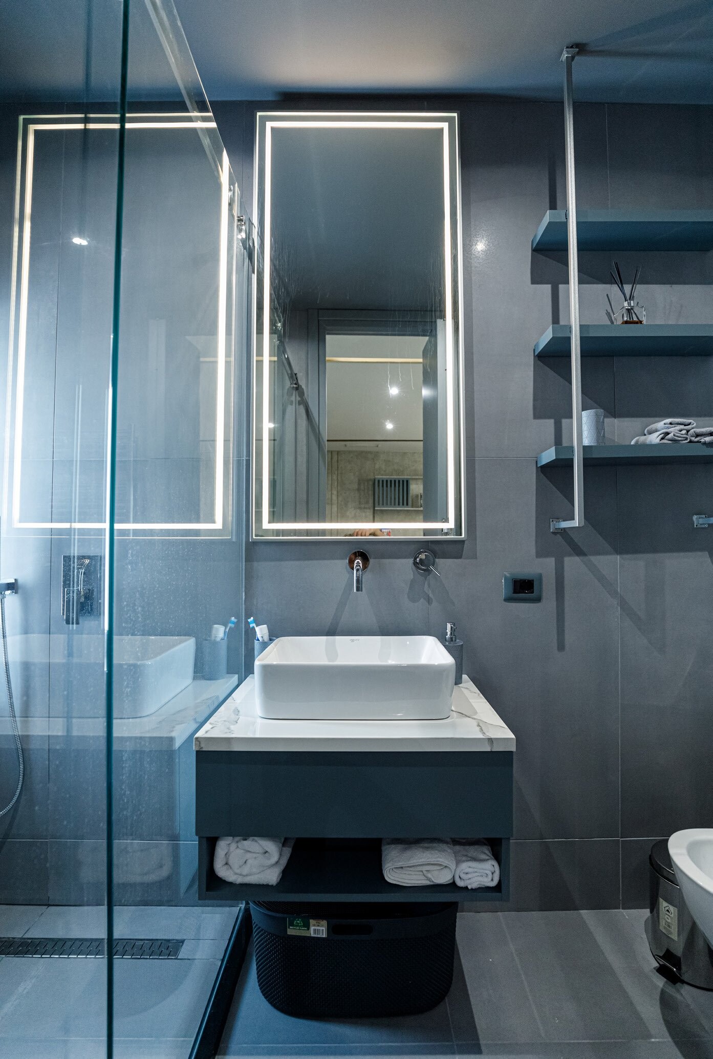 Private Villa South Albania - bathroom with a lit mirror and vessel basin on a dark vanity, Vlore