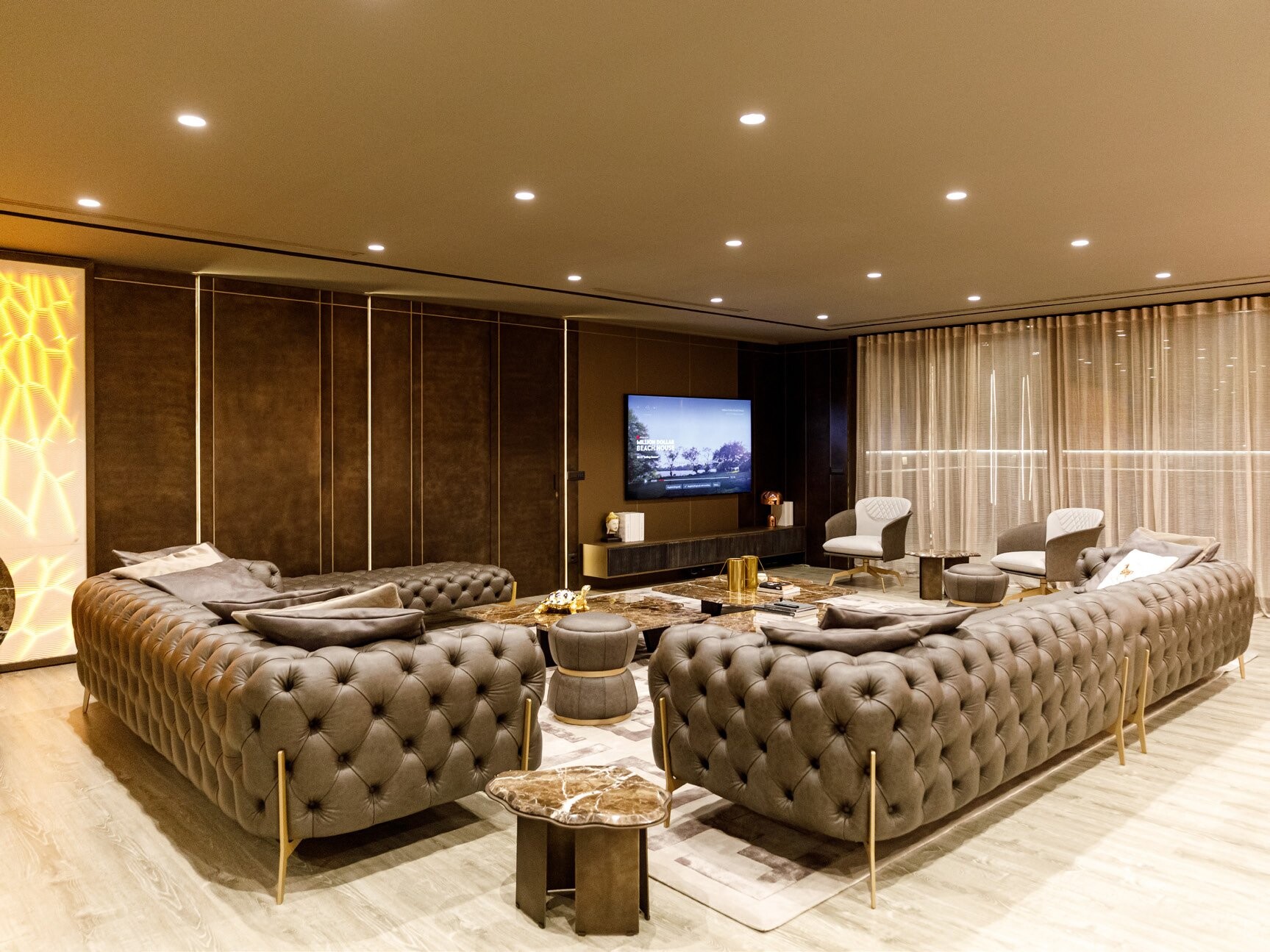 Private Villa South Albania - living room with tufted sofas facing a wall-mounted television, Vlore