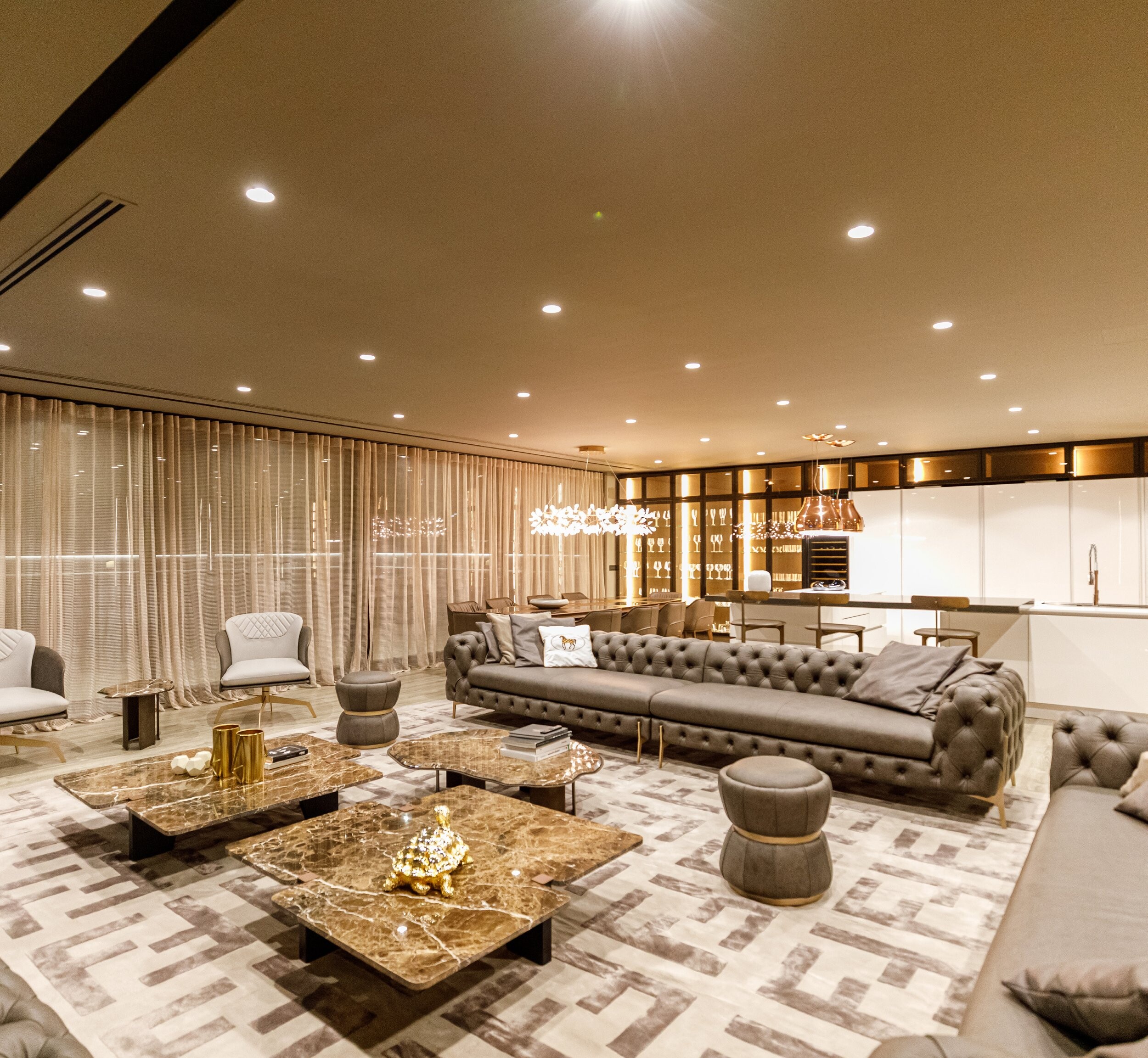 Private Villa South Albania - living room with tufted sofas and gold tables on a patterned rug, Vlore