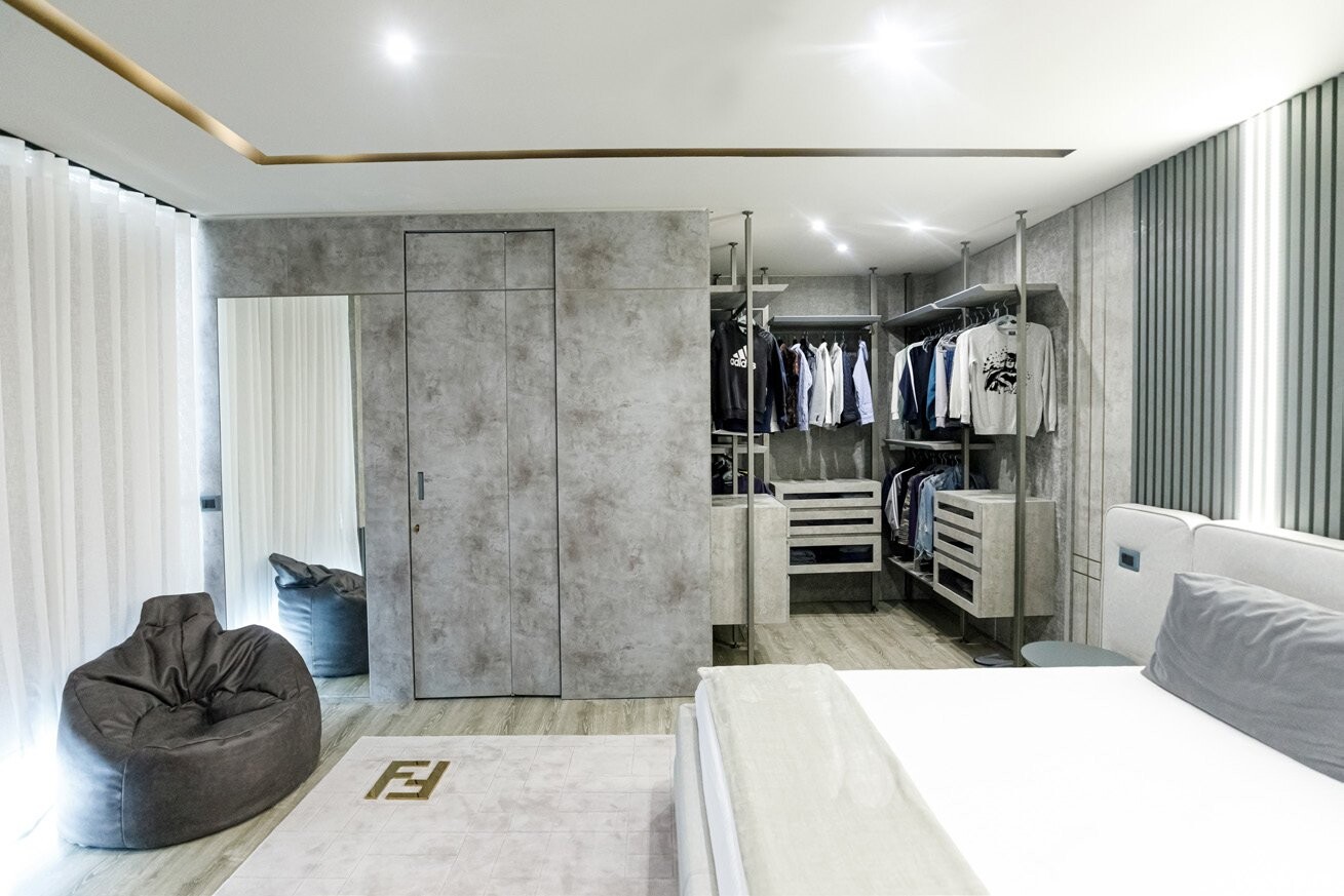Private Villa South Albania - bedroom with a concrete-effect wardrobe wall and a bean bag, Vlore