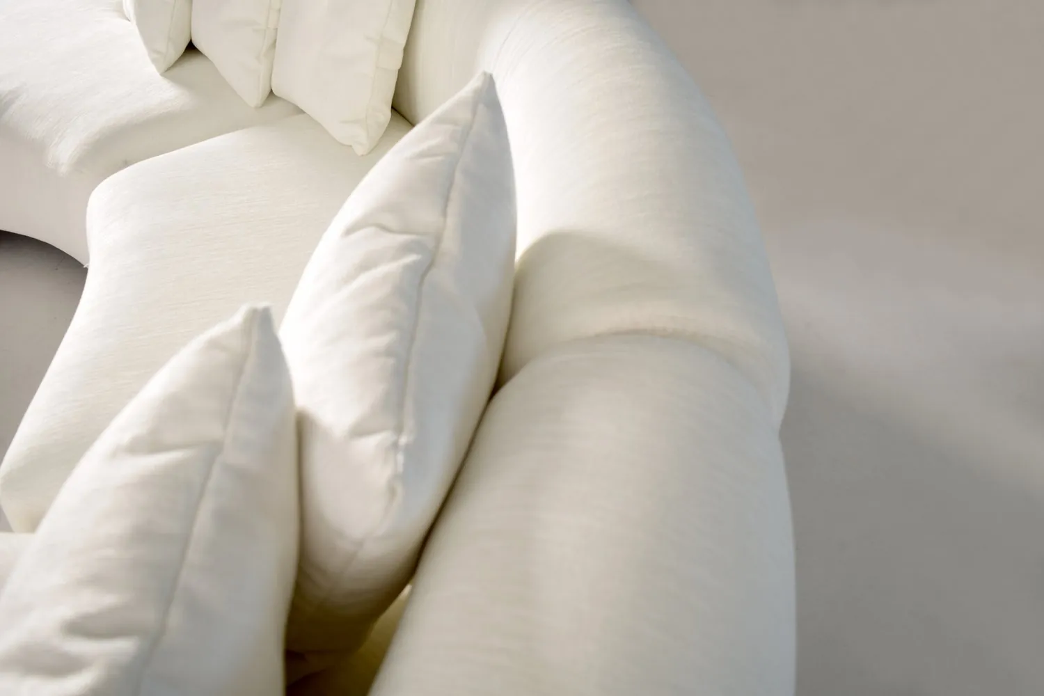 BUBBLÉ Curved Sofa in a modern living room setting