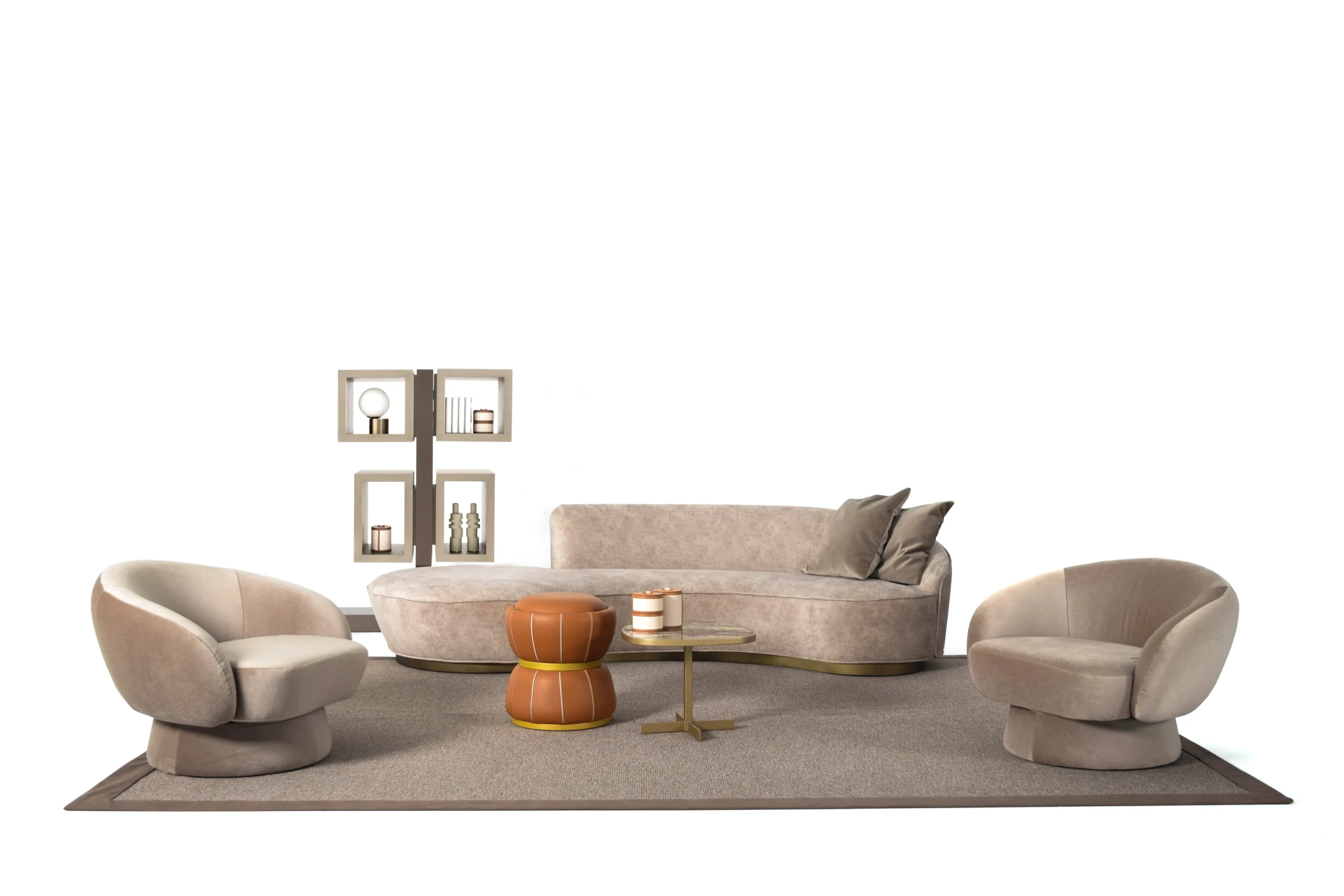 Oscar curved sofa shown with matching lounge chairs and side table